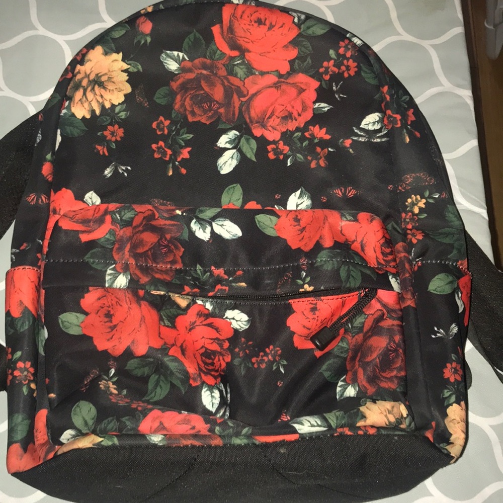 A flower book bag with multiple pockets